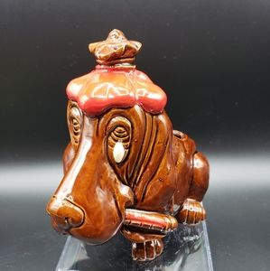 Hung over hound dog ceramic planter.